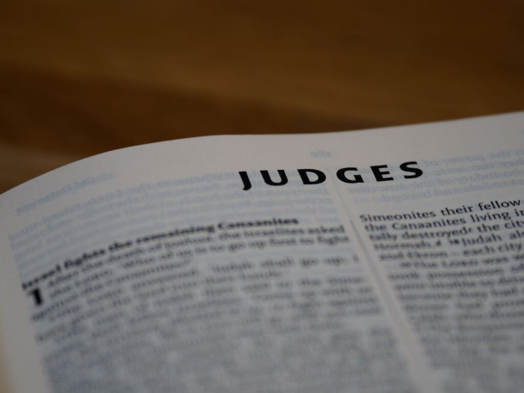 Intimate view of the Book of Judges, highlighting scripture text.